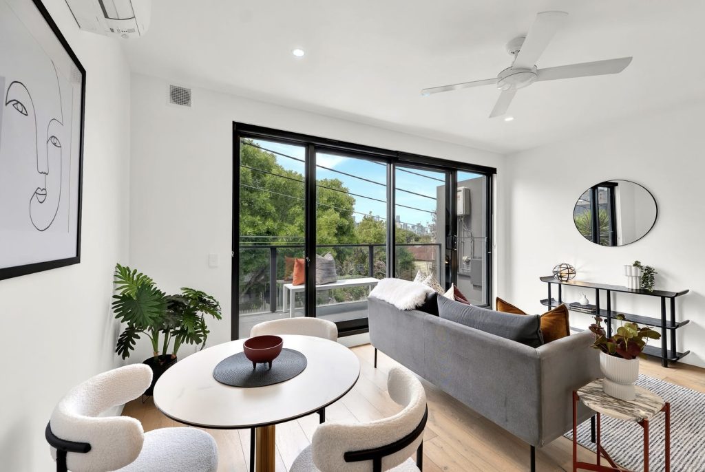 Luxury apartment styling with layered neutrals and indoor-outdoor living