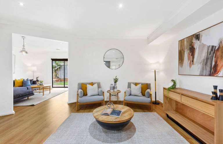 Warm contemporary living room styling with sculptural furniture and neutral palette