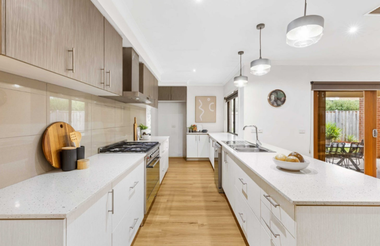 Modern kitchen staging with neutral palette and clean architectural lines